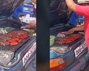Hombre se hace viral al cocinar una carnita asada en la cajuela de su automóvil